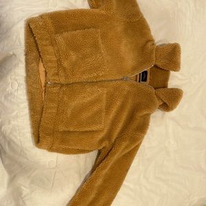 light brown jacket from urban outfitters size M and in perfect condition fluffy